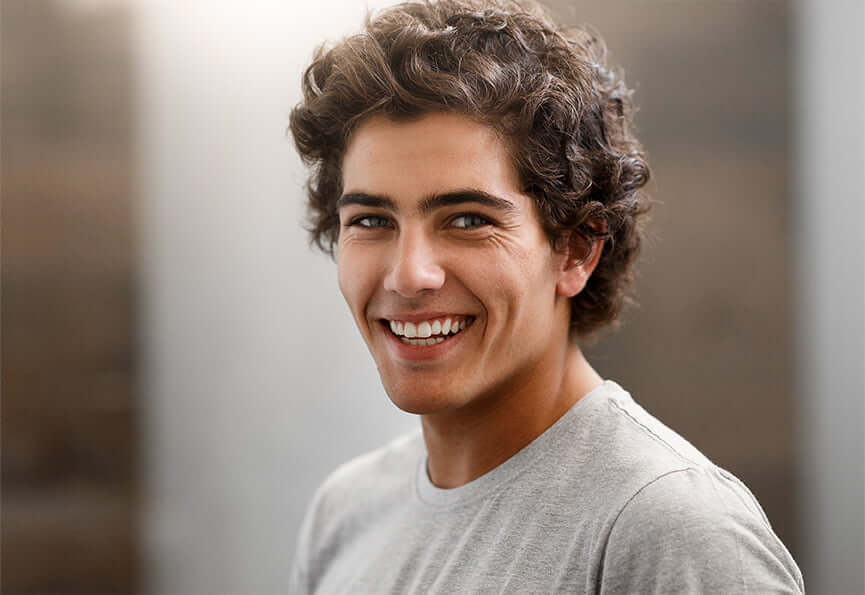 young man with a bright, white smile