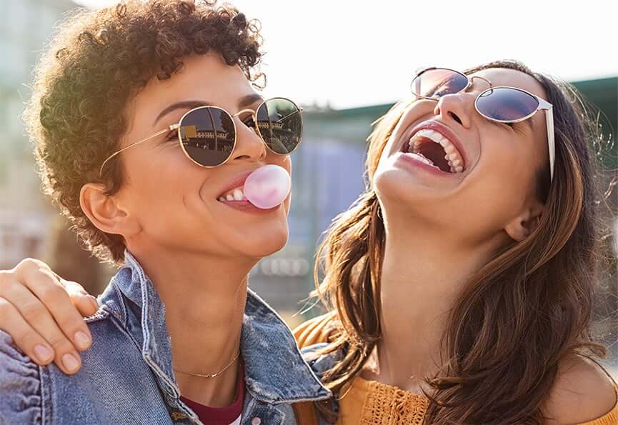 two female friends laughing together