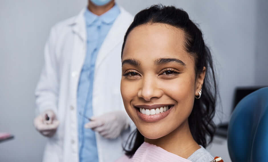 smiling woman sitting in a dental chair