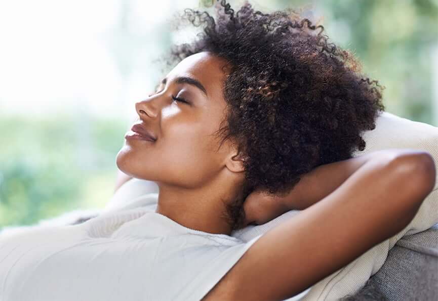 woman relaxing with her eyes closed
