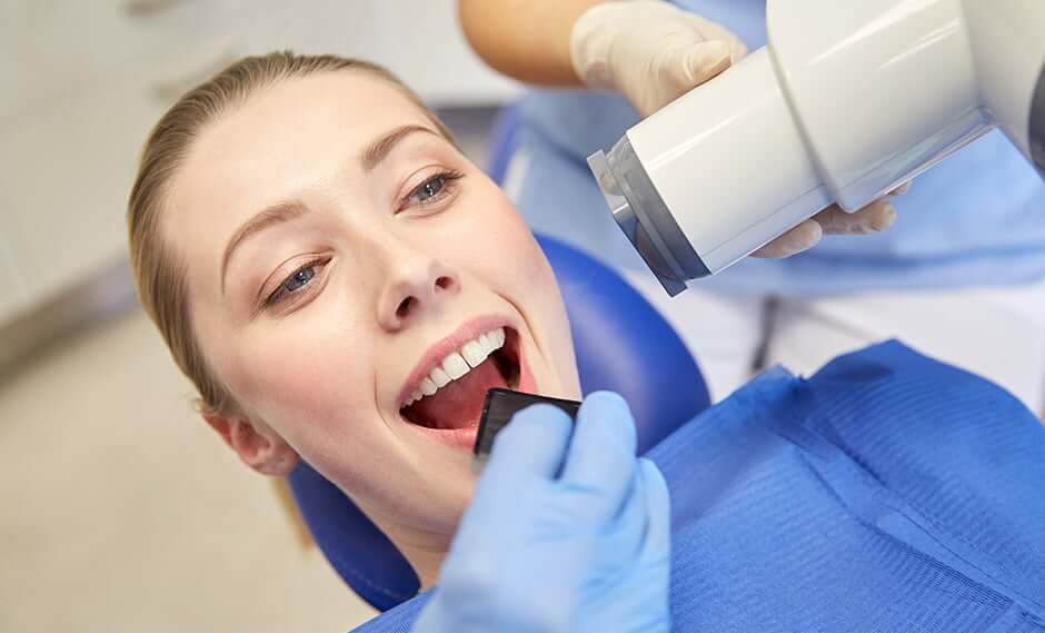 woman receiving a dental x-ray