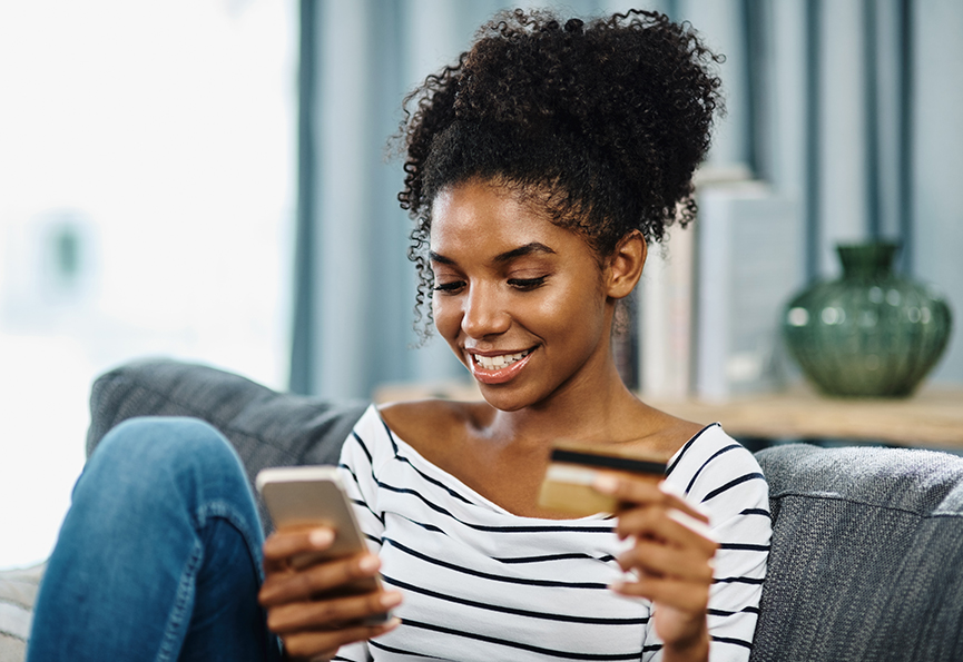 woman with credit card and laptop
